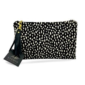 Handmade women owned one-of-a-kind cowhide clutch